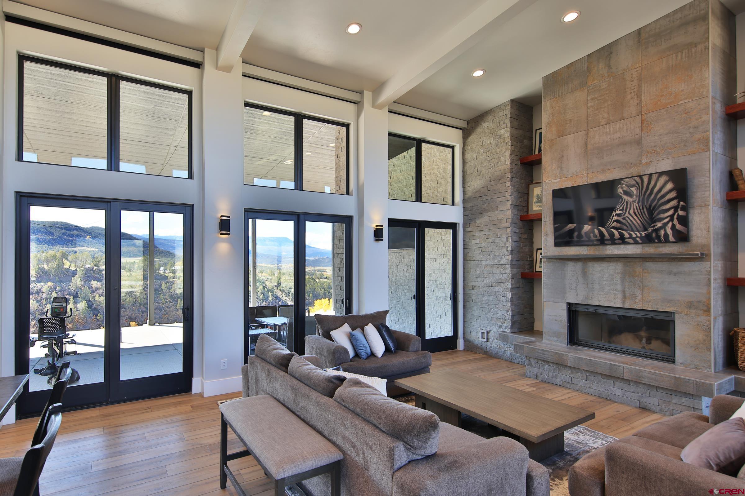 12471 54 7/10 Road Molina, CO 81646 - Photo 13 of 35 a living room with furniture and a fireplace