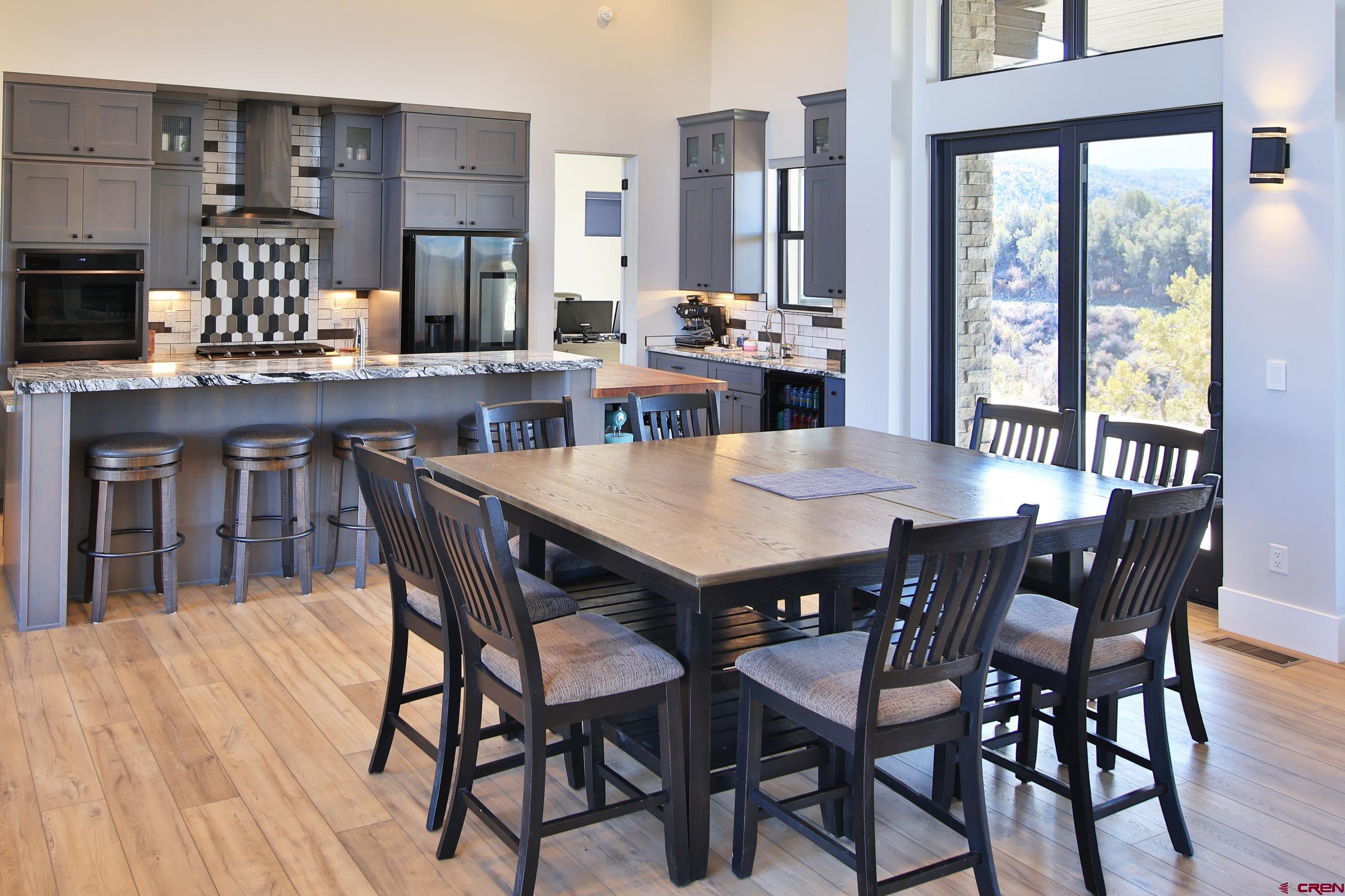 12471 54 7/10 Road Molina, CO 81646 - Photo 15 of 35 a view of a dining room with furniture and wooden floor