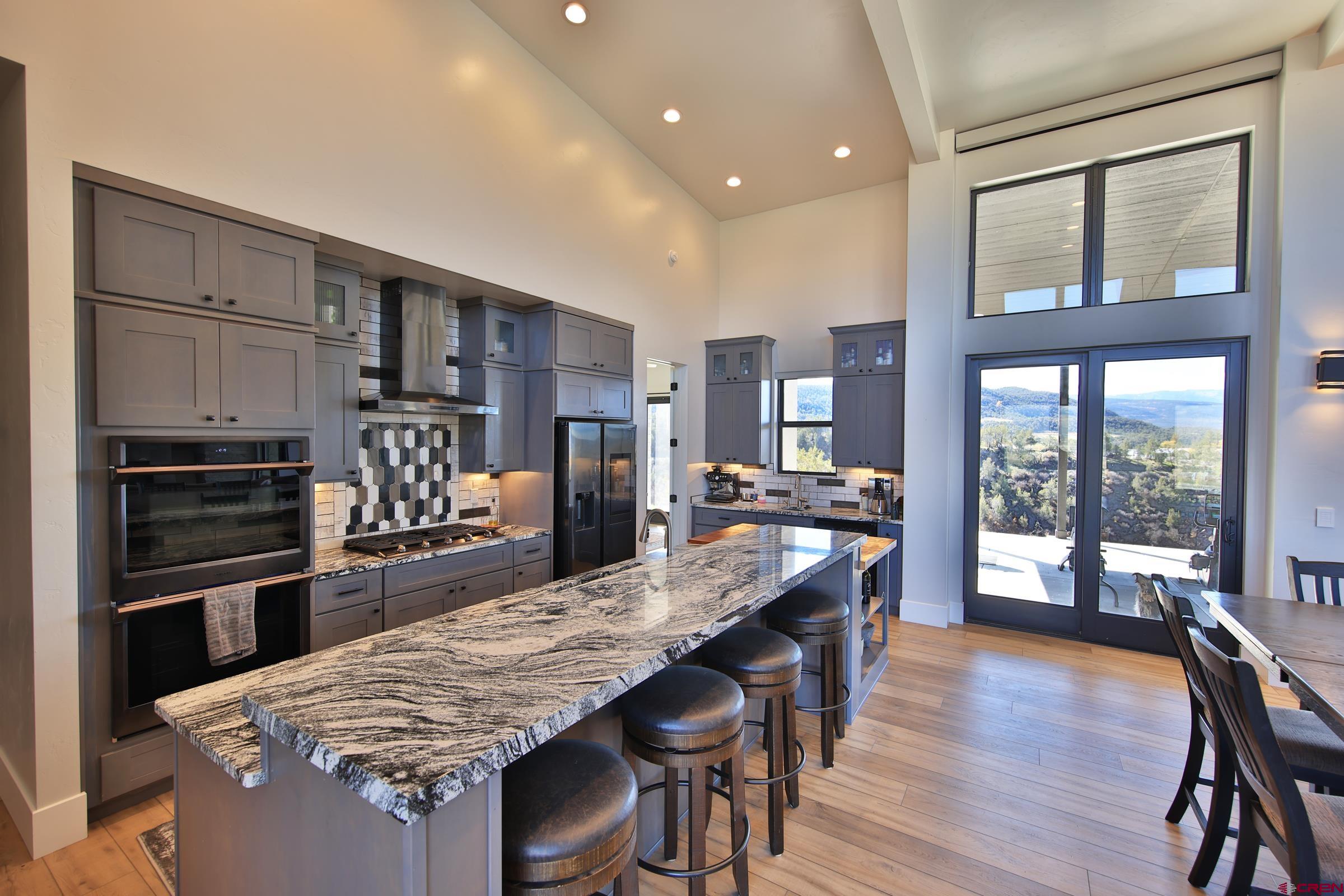 12471 54 7/10 Road Molina, CO 81646 - Photo 16 of 35 a large kitchen with kitchen island a large island in it