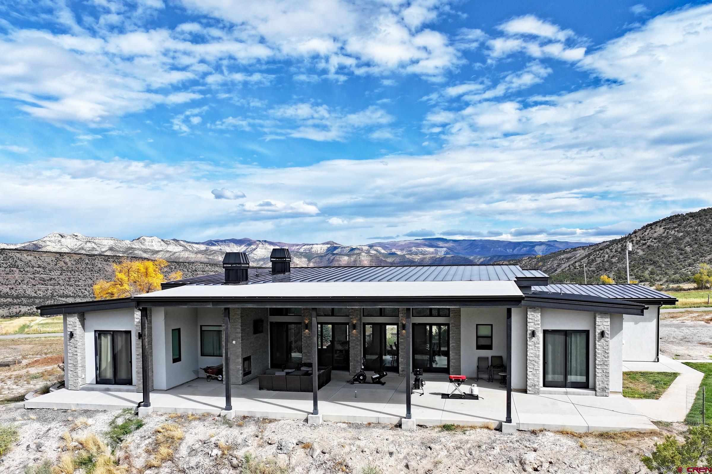 12471 54 7/10 Road Molina, CO 81646 - Photo 2 of 35 a view of a terrace with a barbeque