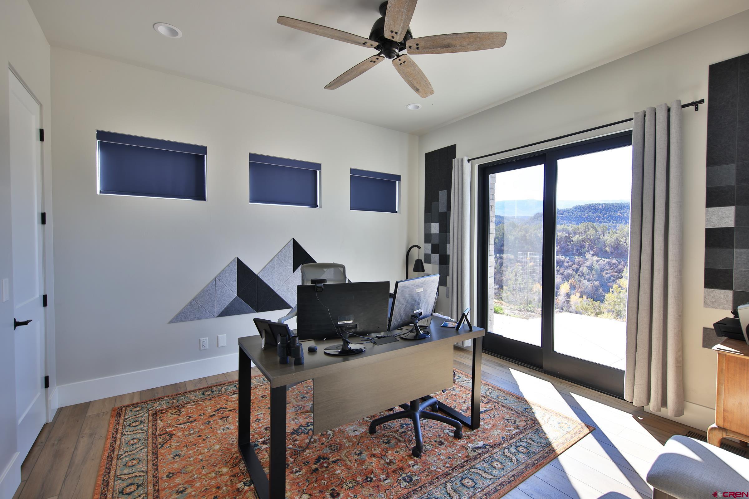 12471 54 7/10 Road Molina, CO 81646 - Photo 26 of 35 a workspace with furniture and a window