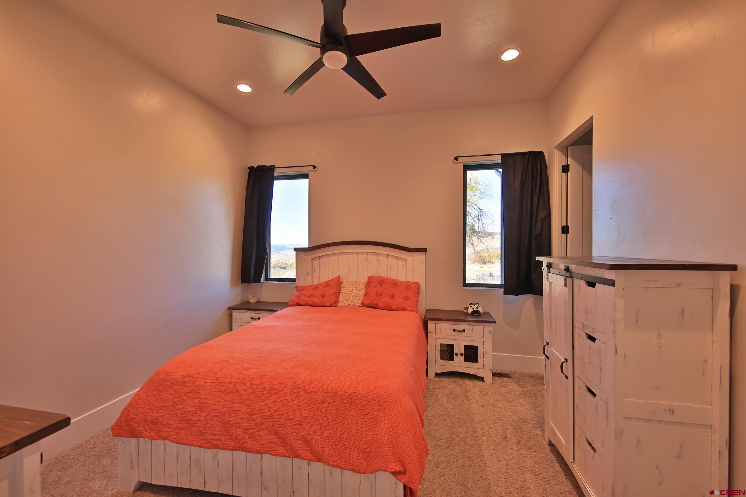 12471 54 7/10 Road Molina, CO 81646 - Photo 3 of 35 a bedroom with a bed next to a window