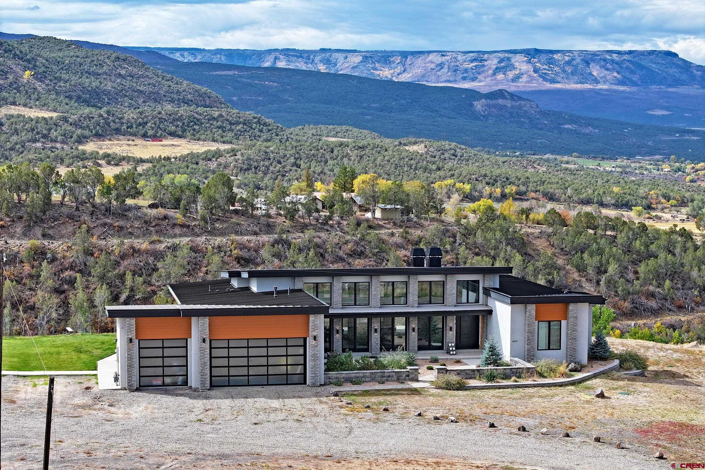 12471 54 7/10 Road Molina, CO 81646 - Photo 34 of 35 a front view of a house with a yard