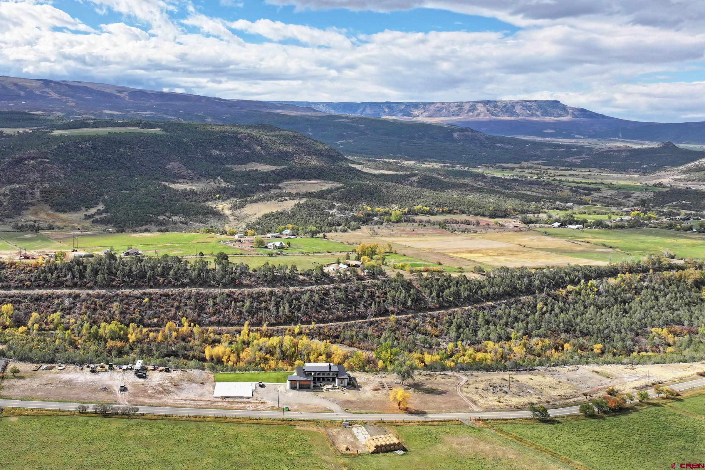 12471 54 7/10 Road Molina, CO 81646 - Photo 7 of 35 a view of a lake with a mountain