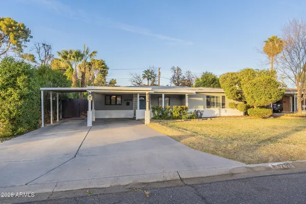 front view of a house with a patio
