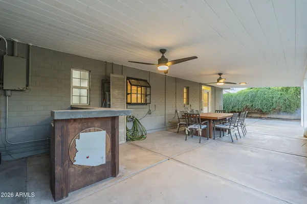 a view of a house with backyard and porch
