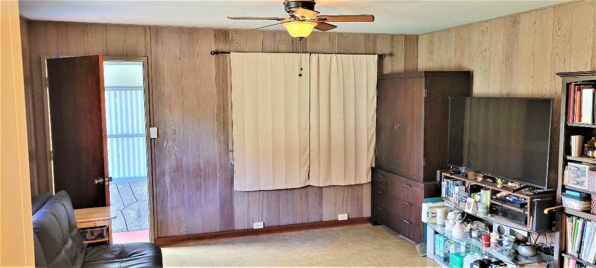 4417 Upa Road Koloa, HI 96756 - Photo 8 of 20 a view of a livingroom with entryway window and cabinet