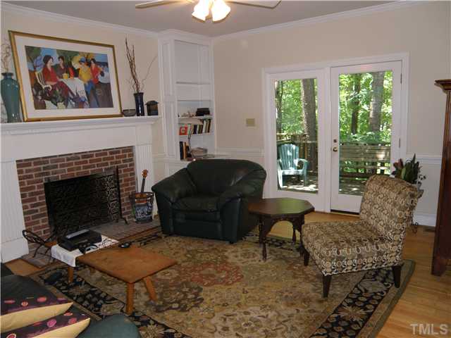 2508 Ashley Court Raleigh, NC 27607 - Photo 6 of 12 Well proportioned family room with built-ins and a masonry fireplace. The multi-level deck is accessible from this room.