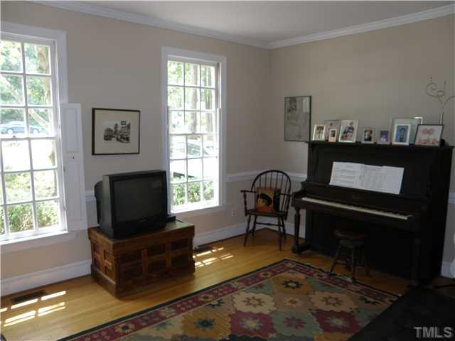 2508 Ashley Court Raleigh, NC 27607 - Photo 7 of 12 Nice wood shutters in this living room.