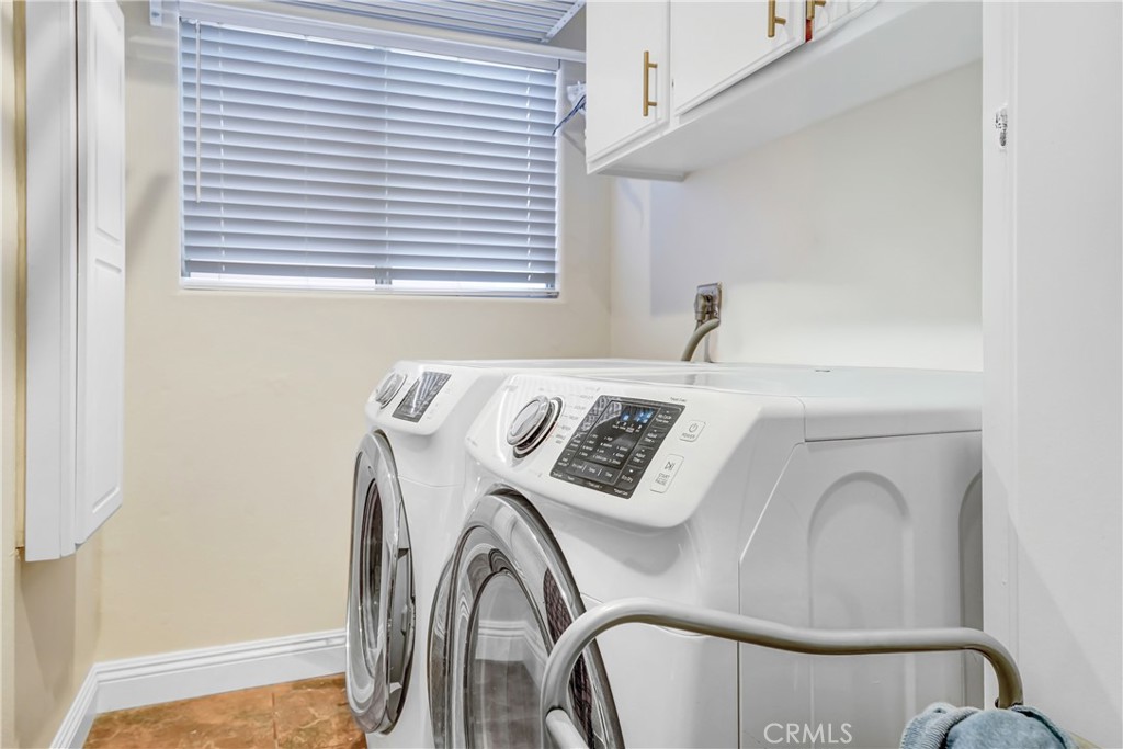 25803 Browning Place Stevenson Ranch, CA 91381 - Photo 12 of 20 a close view of a utility room with washer and dryer