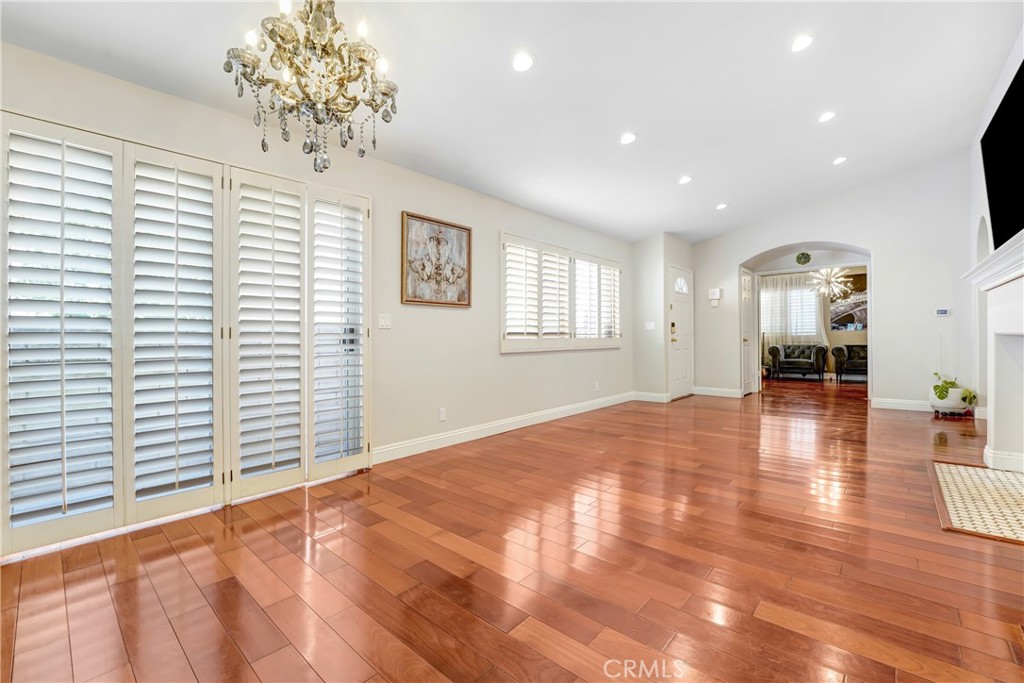 25803 Browning Place Stevenson Ranch, CA 91381 - Photo 4 of 20 a view of an empty room with a window and wooden floor