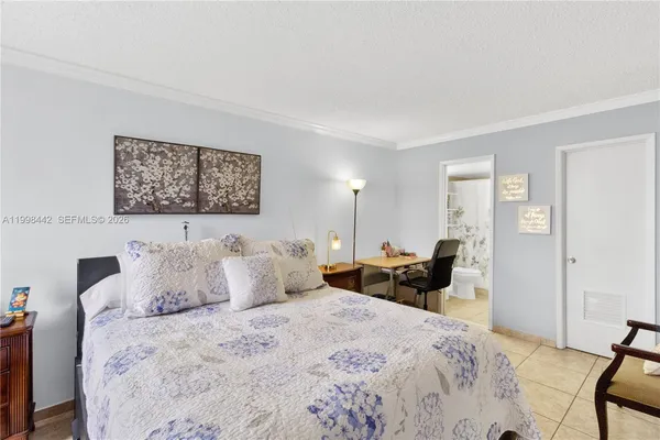 a bedroom with bed and a window