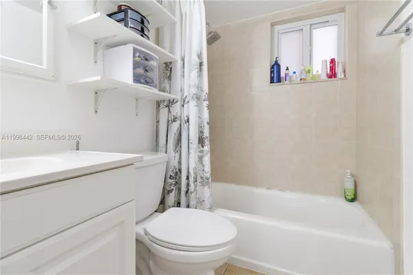 a bathroom with a sink a toilet and a bathtub