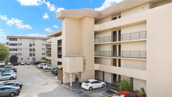 a room with furniture a rug and a chandelier