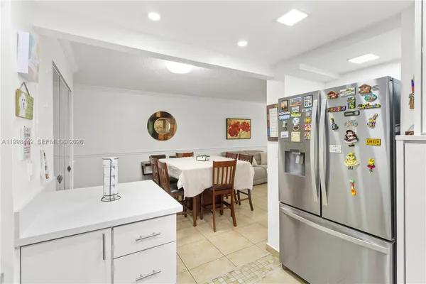 a kitchen with stainless steel appliances a refrigerator and a sink