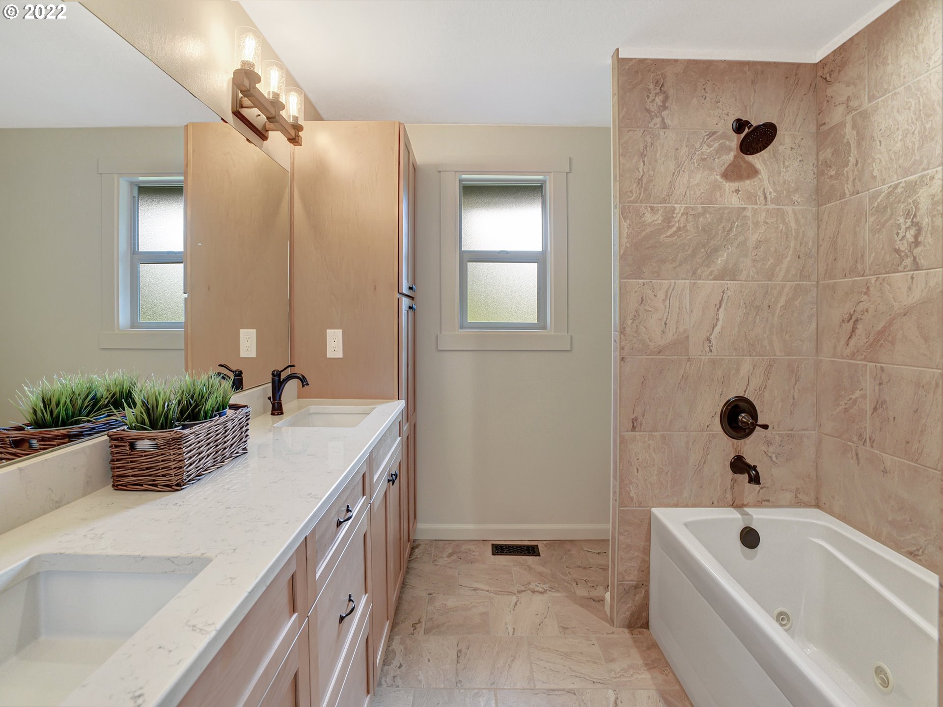 37490 Southeast Dunn Road Sandy, OR 97055 - Photo 16 of 29 a bathroom with a tub a sink a potted plant and a window