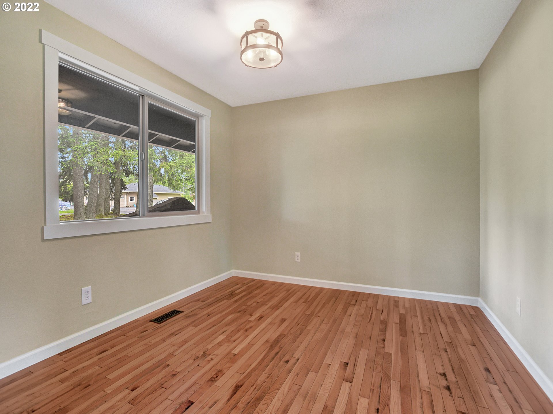 37490 Southeast Dunn Road Sandy, OR 97055 - Photo 24 of 29 a view of a room with wooden floor and windows