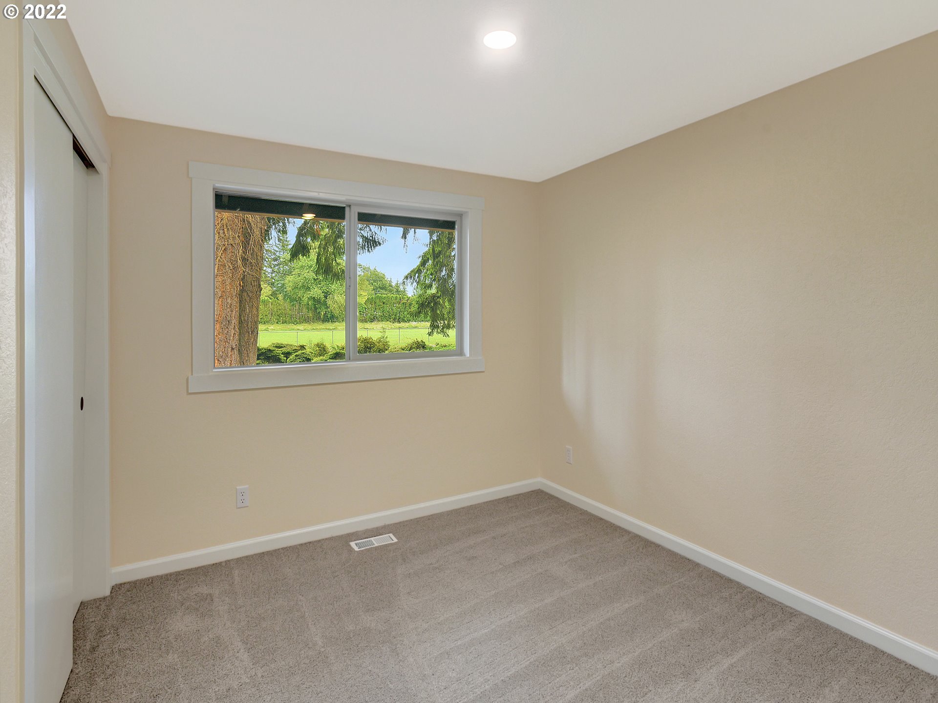 37490 Southeast Dunn Road Sandy, OR 97055 - Photo 28 of 29 an empty room with wooden floor and windows