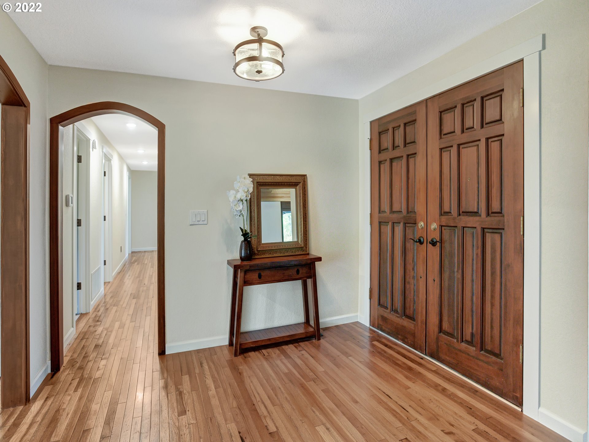 37490 Southeast Dunn Road Sandy, OR 97055 - Photo 6 of 29 a view of a hallway with wooden floor and staircase