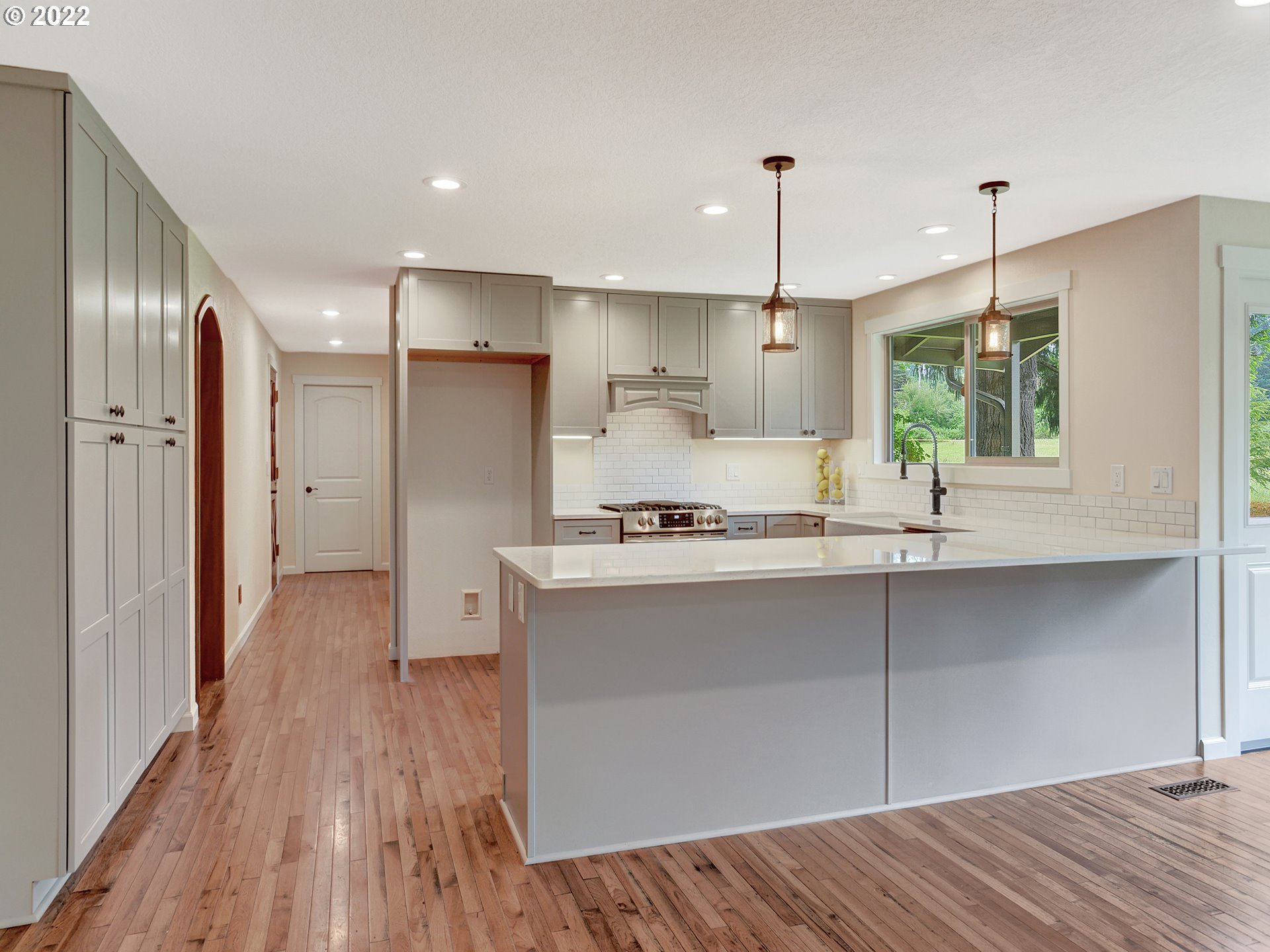 37490 Southeast Dunn Road Sandy, OR 97055 - Photo 7 of 29 a kitchen with stainless steel appliances a refrigerator sink and wooden floor
