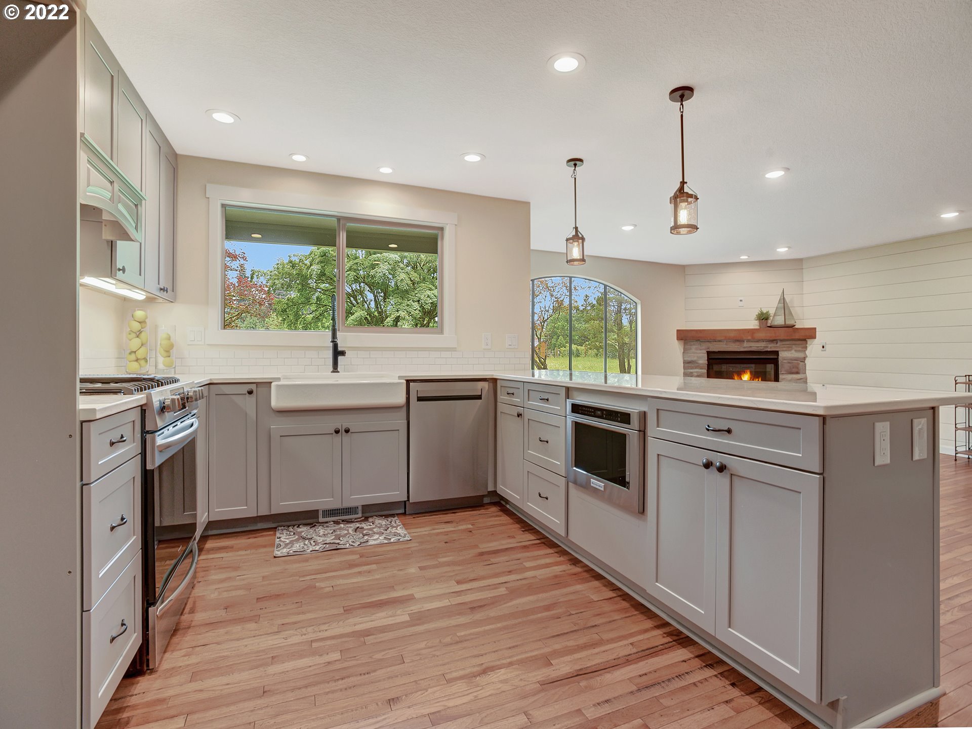 37490 Southeast Dunn Road Sandy, OR 97055 - Photo 9 of 29 a kitchen with stainless steel appliances granite countertop a sink a stove and a wooden floors