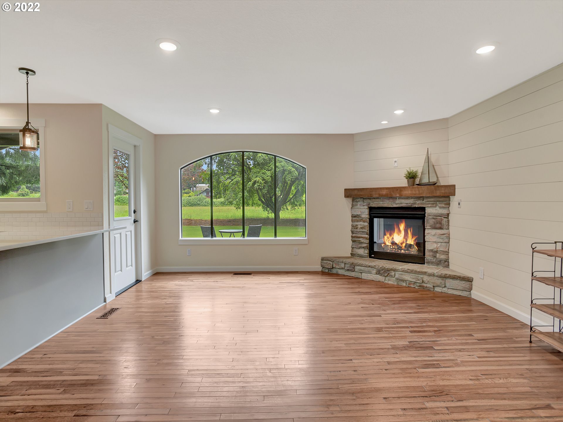 37490 Southeast Dunn Road Sandy, OR 97055 - Photo 10 of 29 a view of an empty room with a fireplace and a window