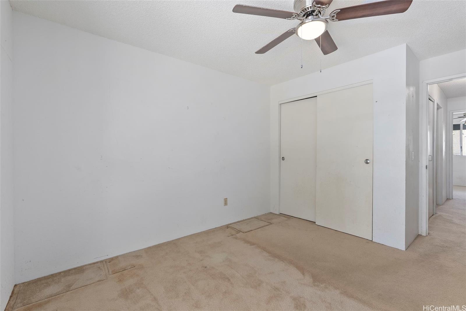 94-201 Lumiaina Place, Unit E202 Waipahu, HI 96797 - Photo 12 of 25 a view of a room with a fan