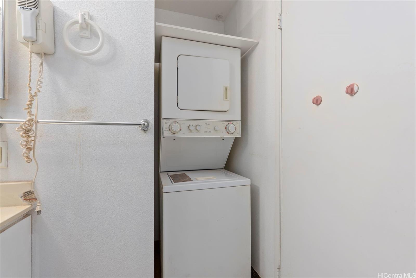 94-201 Lumiaina Place, Unit E202 Waipahu, HI 96797 - Photo 19 of 25 a utility room with dryer and washer