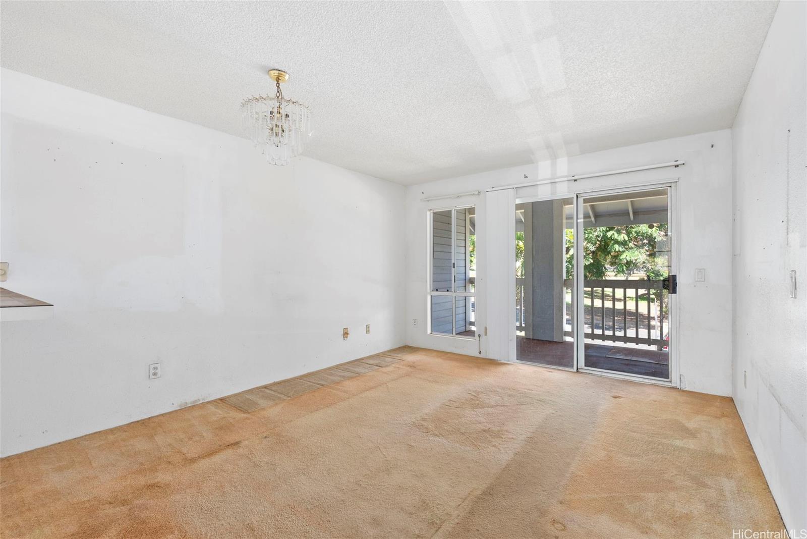 94-201 Lumiaina Place, Unit E202 Waipahu, HI 96797 - Photo 2 of 25 a view of an empty room with a window