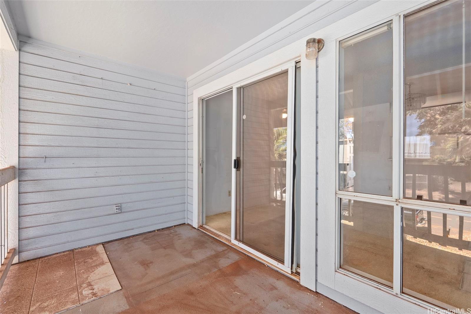 94-201 Lumiaina Place, Unit E202 Waipahu, HI 96797 - Photo 21 of 25 a view of front door and utility room