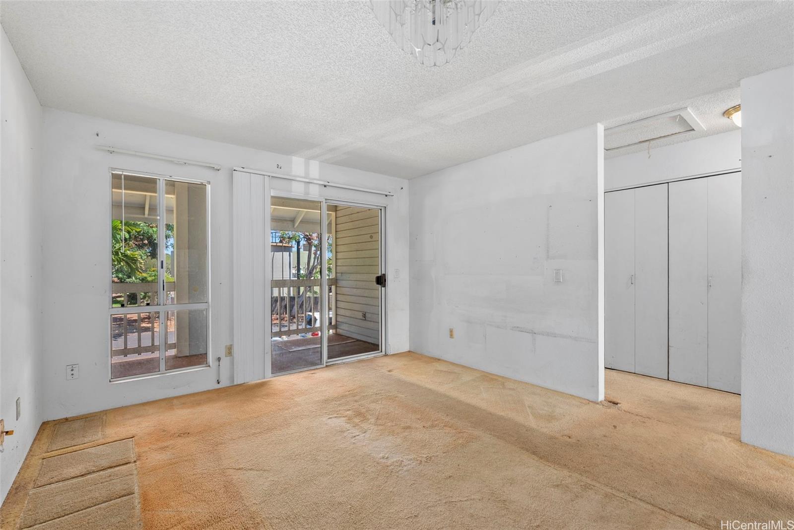 94-201 Lumiaina Place, Unit E202 Waipahu, HI 96797 - Photo 3 of 25 a view of an empty room with a window