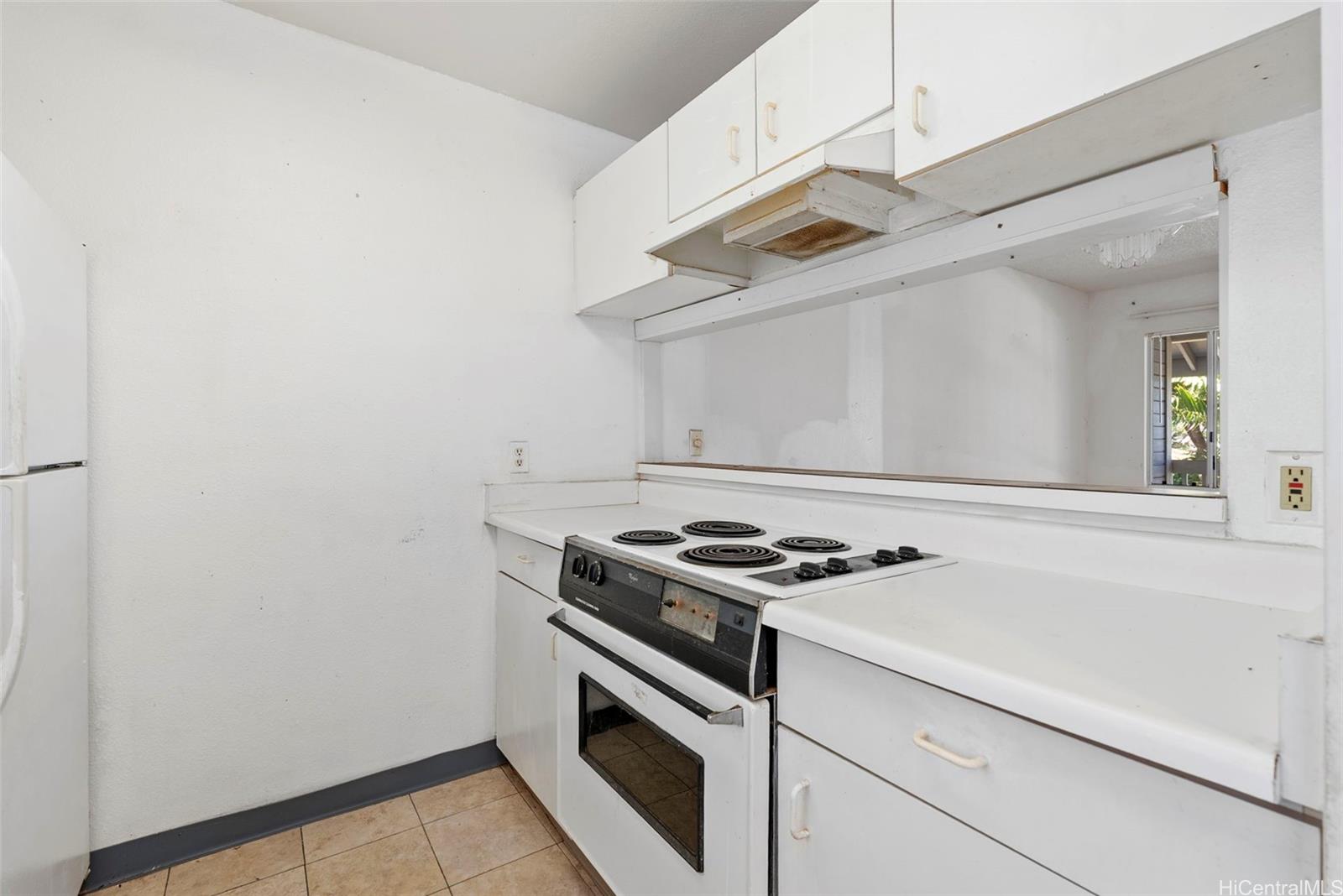 94-201 Lumiaina Place, Unit E202 Waipahu, HI 96797 - Photo 8 of 25 a view of kitchen and utility room