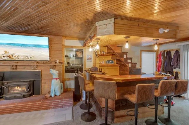 a dining room with furniture and a fireplace