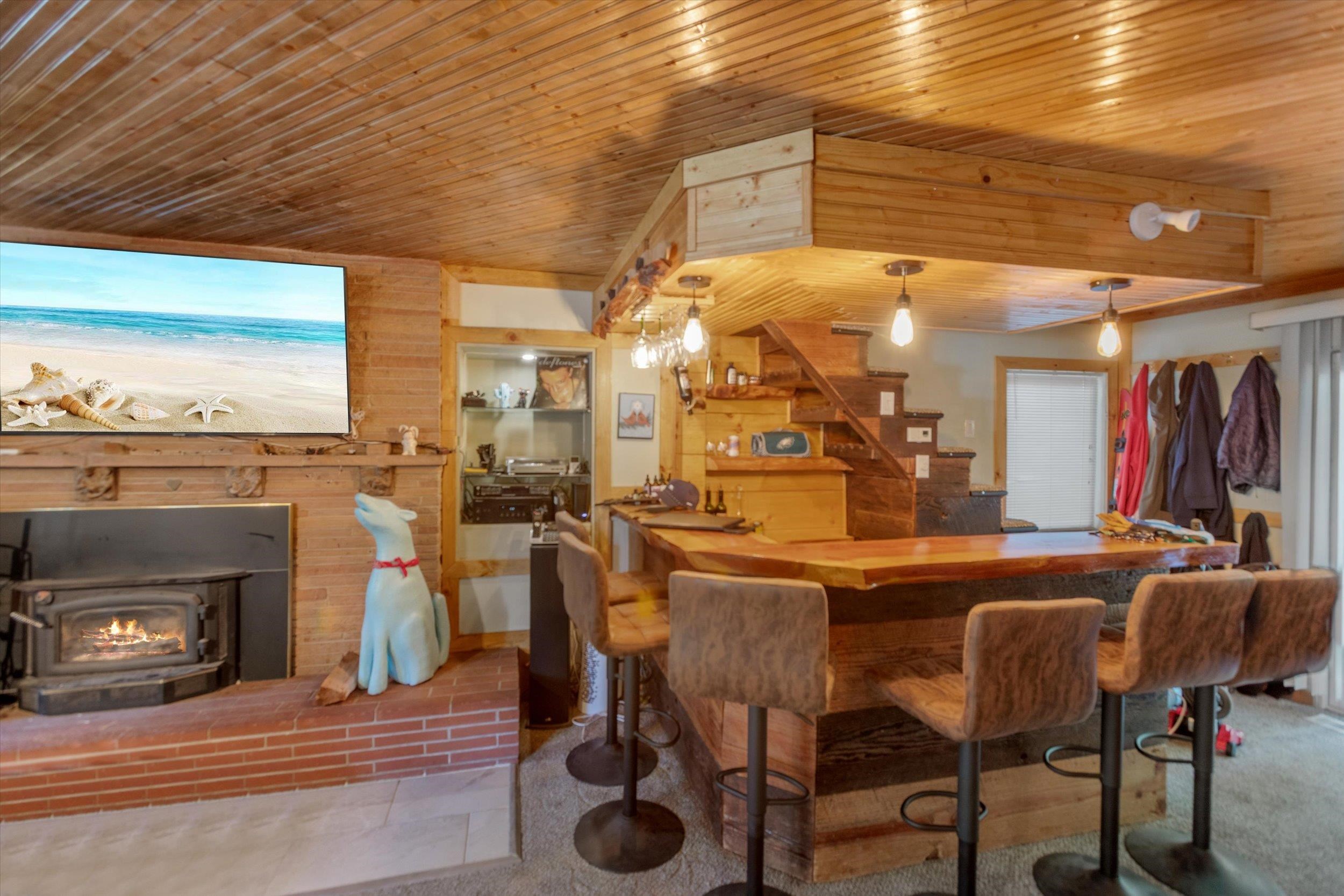 a dining room with furniture and a fireplace
