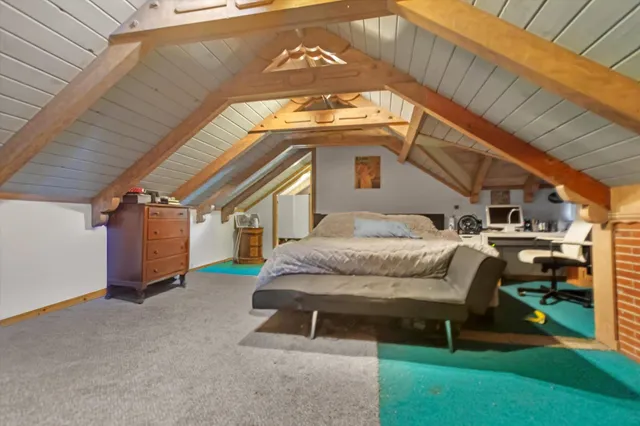 a bedroom with bed and balcony