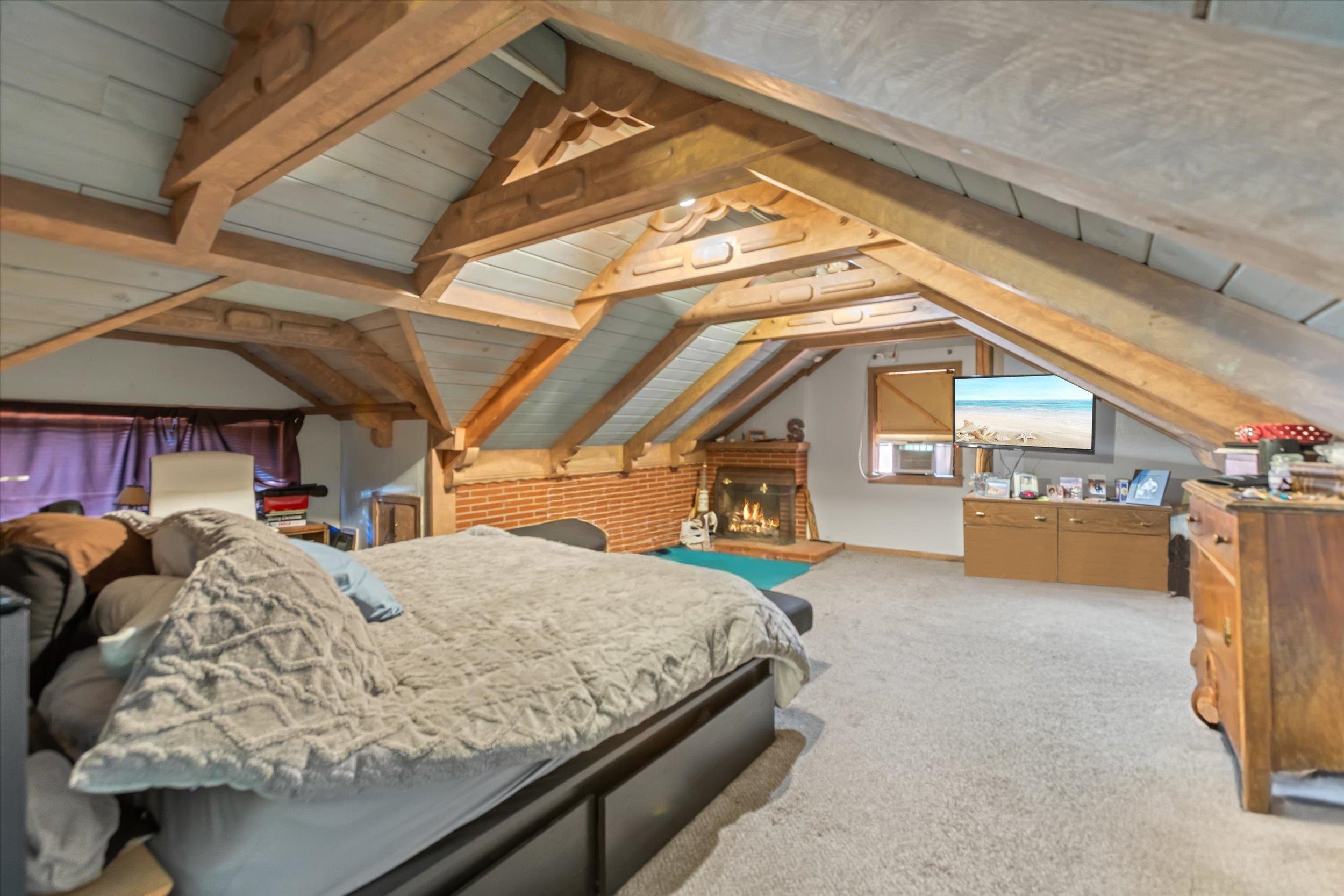 4115 North Lake Boulevard Carnelian Bay, CA 96140 - Photo 15 of 28 a bedroom with bed and balcony