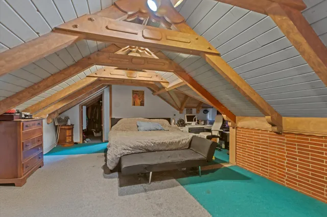 a roof deck with table and chairs