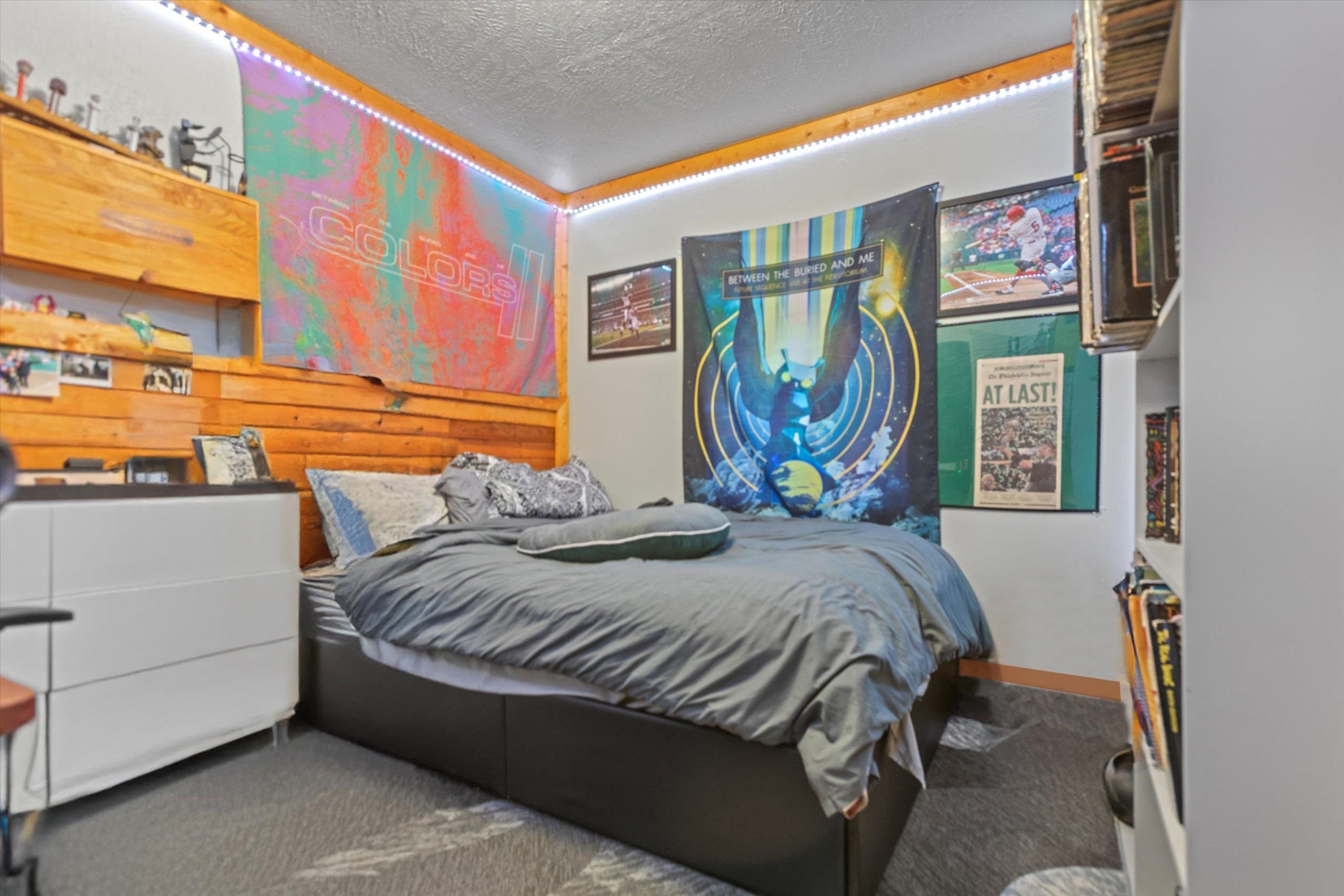 4115 North Lake Boulevard Carnelian Bay, CA 96140 - Photo 19 of 28 a bedroom with a bed and a painting on the wall