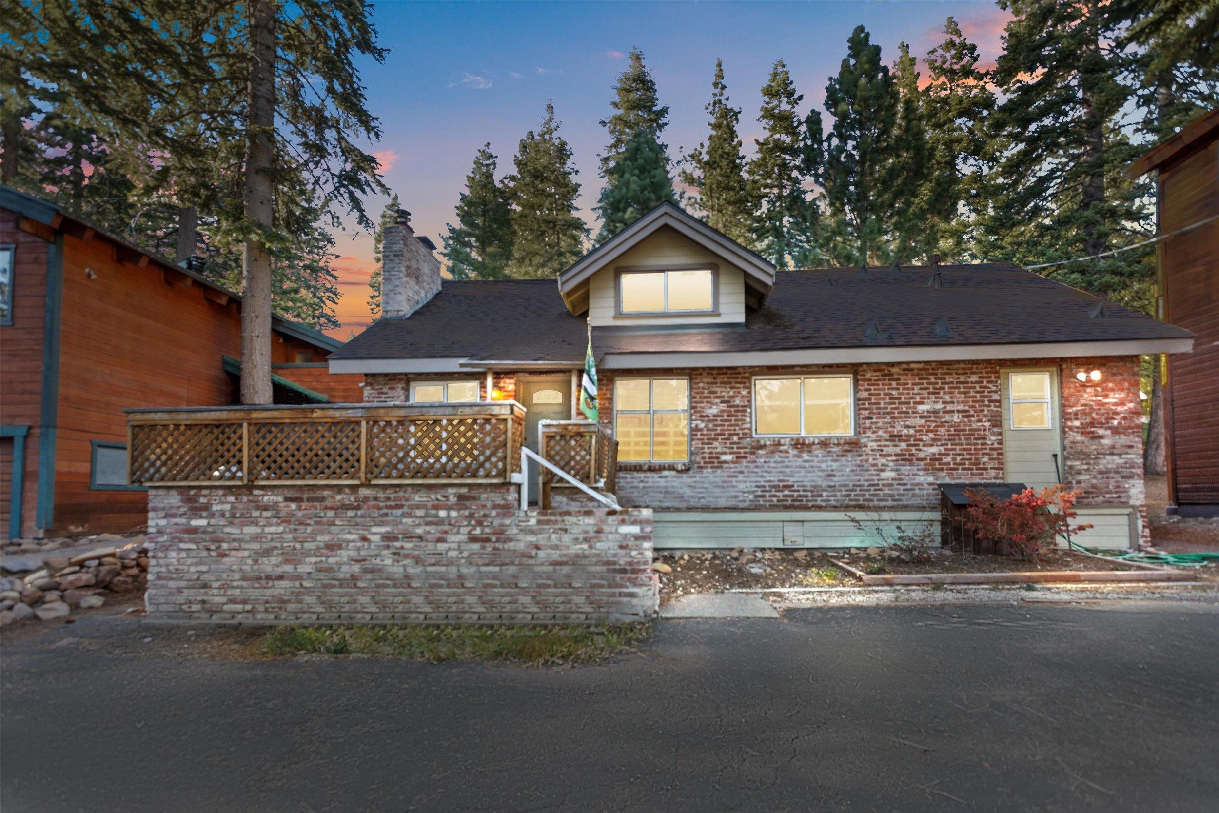 4115 North Lake Boulevard Carnelian Bay, CA 96140 - Photo 2 of 28 a view of a house with a yard