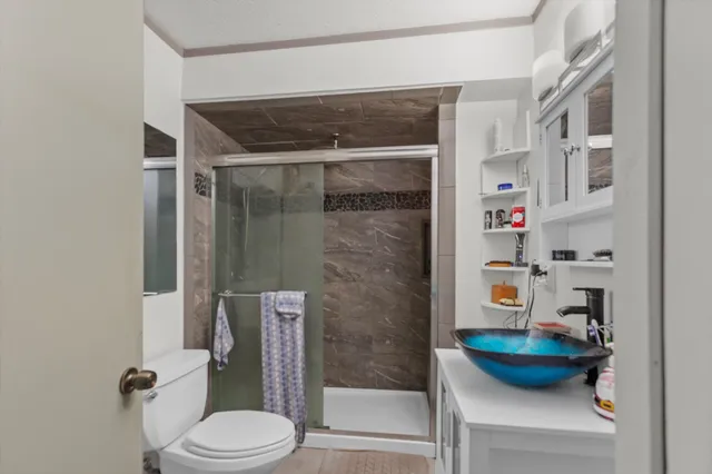 a bathroom with a bathtub and a toilet