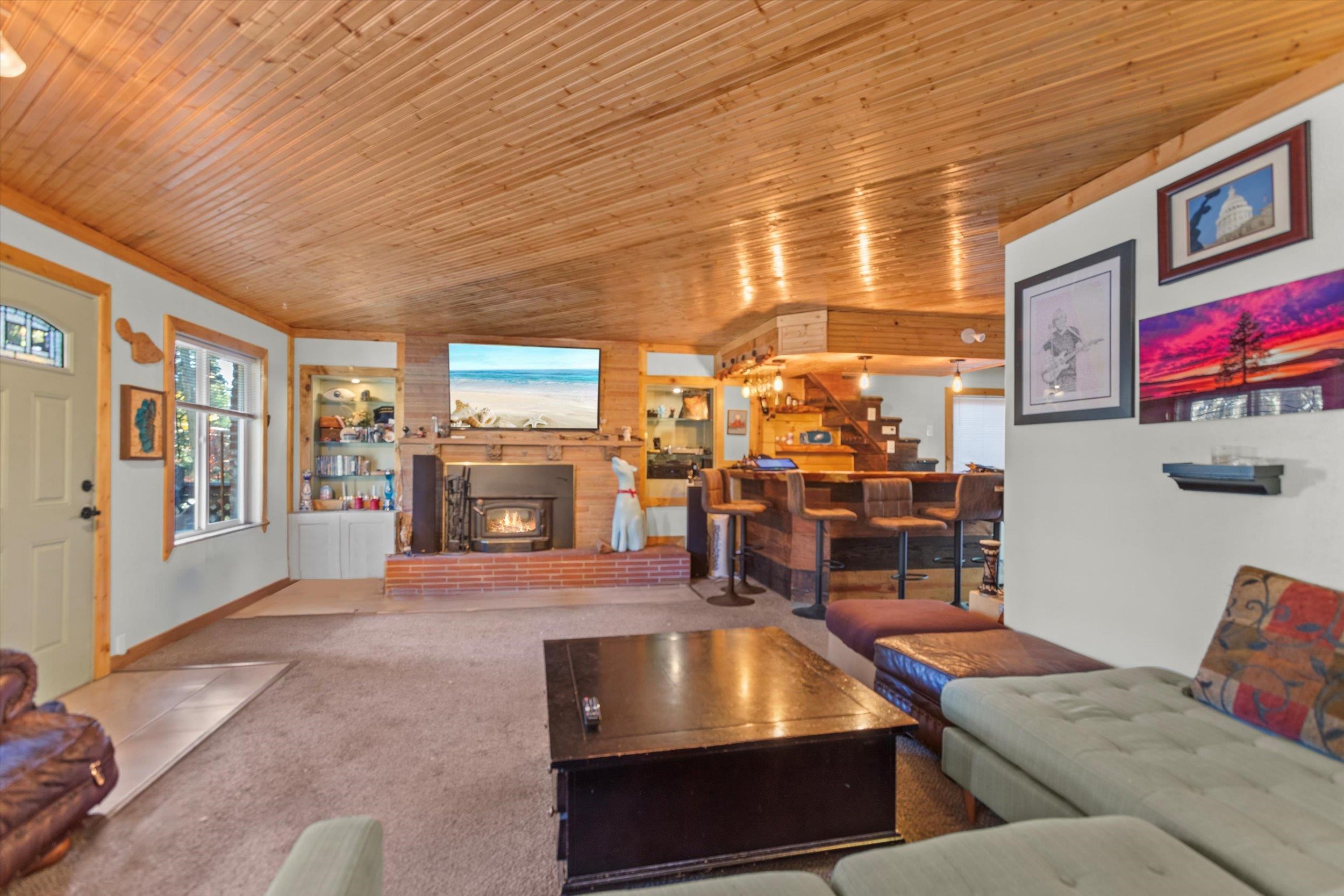 4115 North Lake Boulevard Carnelian Bay, CA 96140 - Photo 7 of 28 a living room with furniture pool table and flat screen tv