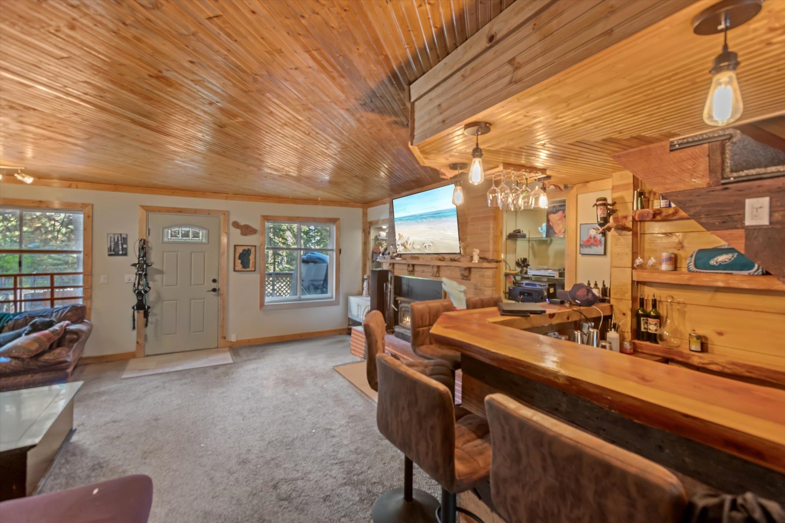 4115 North Lake Boulevard Carnelian Bay, CA 96140 - Photo 8 of 28 a view of a dining room with furniture window and outside view