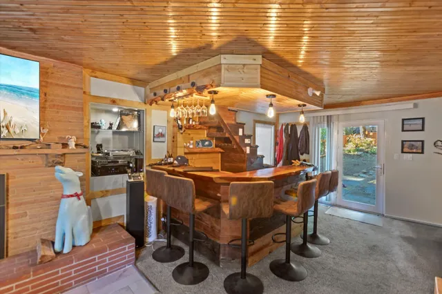 a view of a dining room with furniture and chandelier