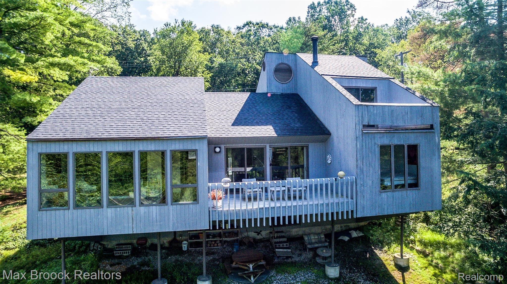 5724 North Livernois Road Rochester, MI 48306 - Photo 3 of 52 Designed with views in mind. Walls of windows, balcony's and patio,