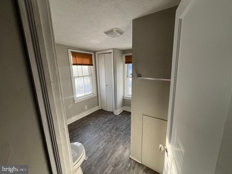 81 Main Street Yorkana, PA 17406 - Photo 12 of 16 a view of an empty room with wooden floor and a window