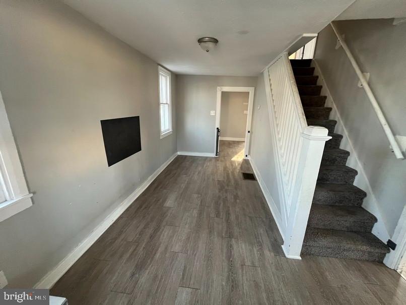 81 Main Street Yorkana, PA 17406 - Photo 3 of 16 a view of a livingroom with wooden floor and stairs