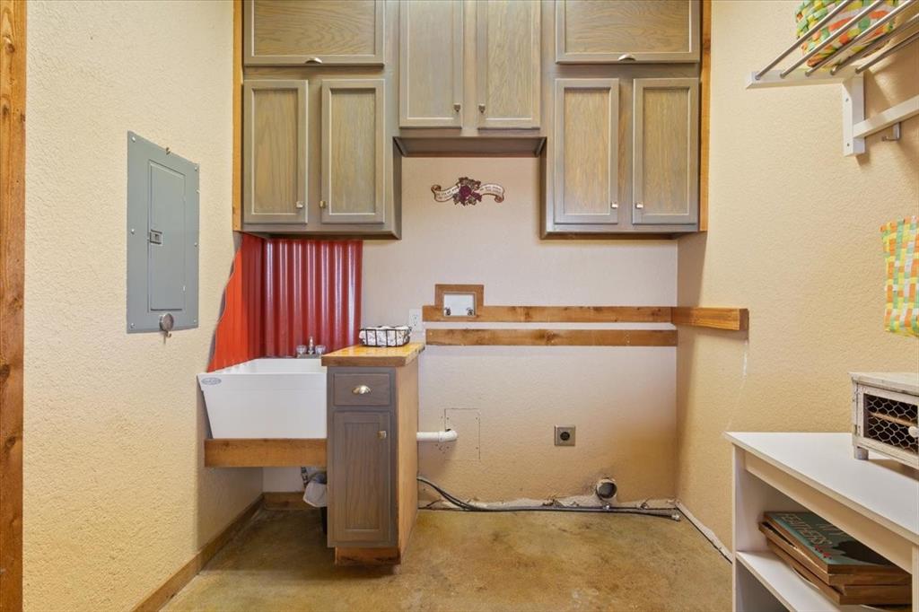 174 Ross Rd Spur Waco, TX 76705 - Photo 27 of 40 Mudroom with exterior door to back patio, storage cabinets