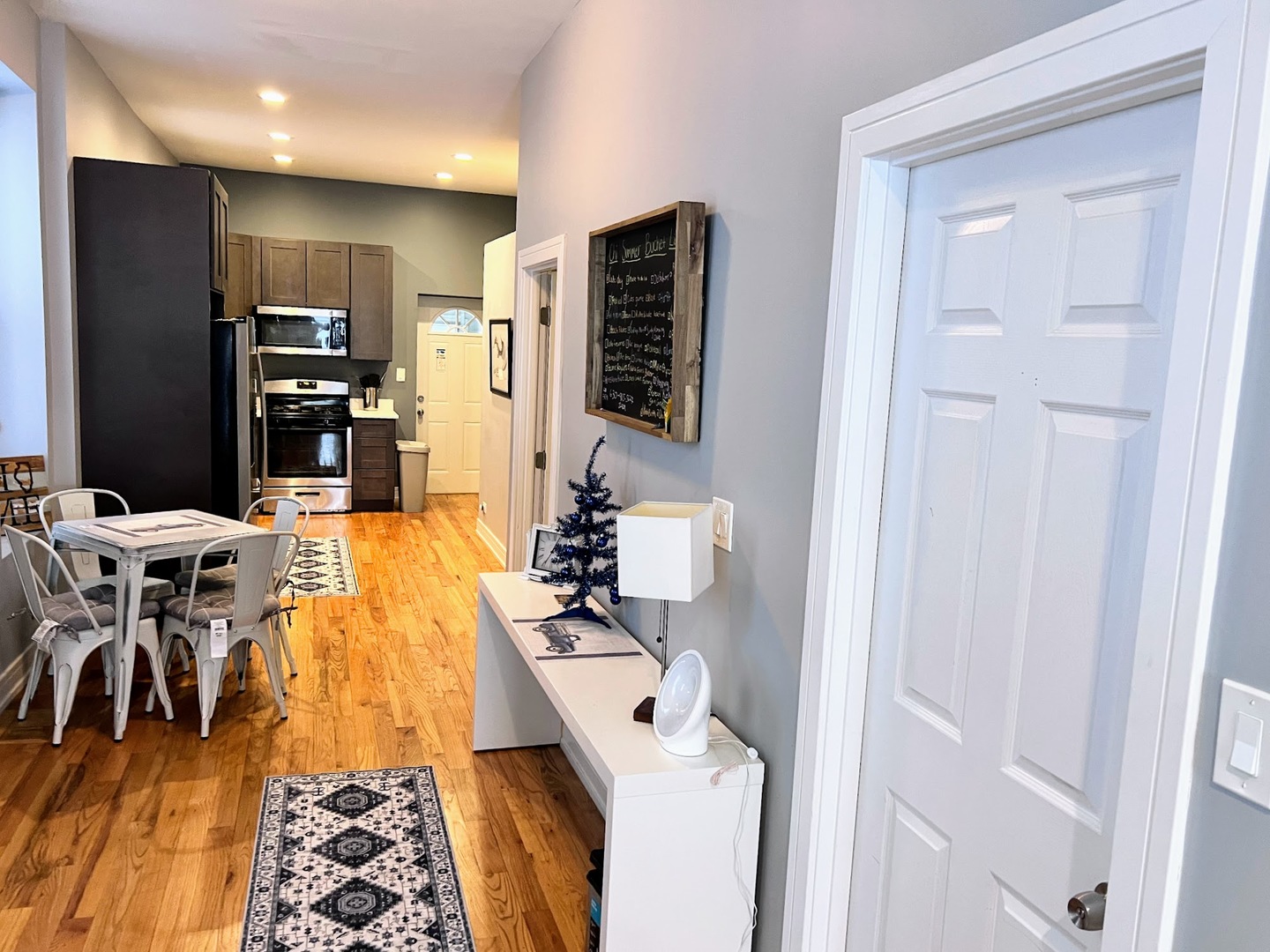 113 South Paulina Street, Unit 3 Chicago, IL 60612 - Photo 5 of 13 a very nice looking dining room with a large window and stainless steel appliances