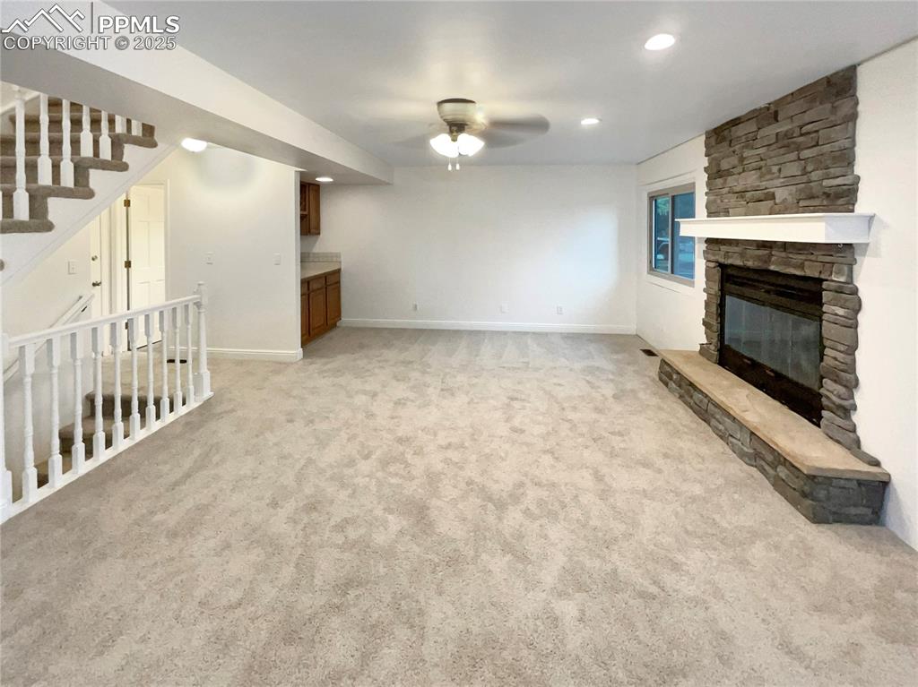 570 Ore Cart Way Monument, CO 80132 - Photo 2 of 22 a view of an empty room with fireplace and a window
