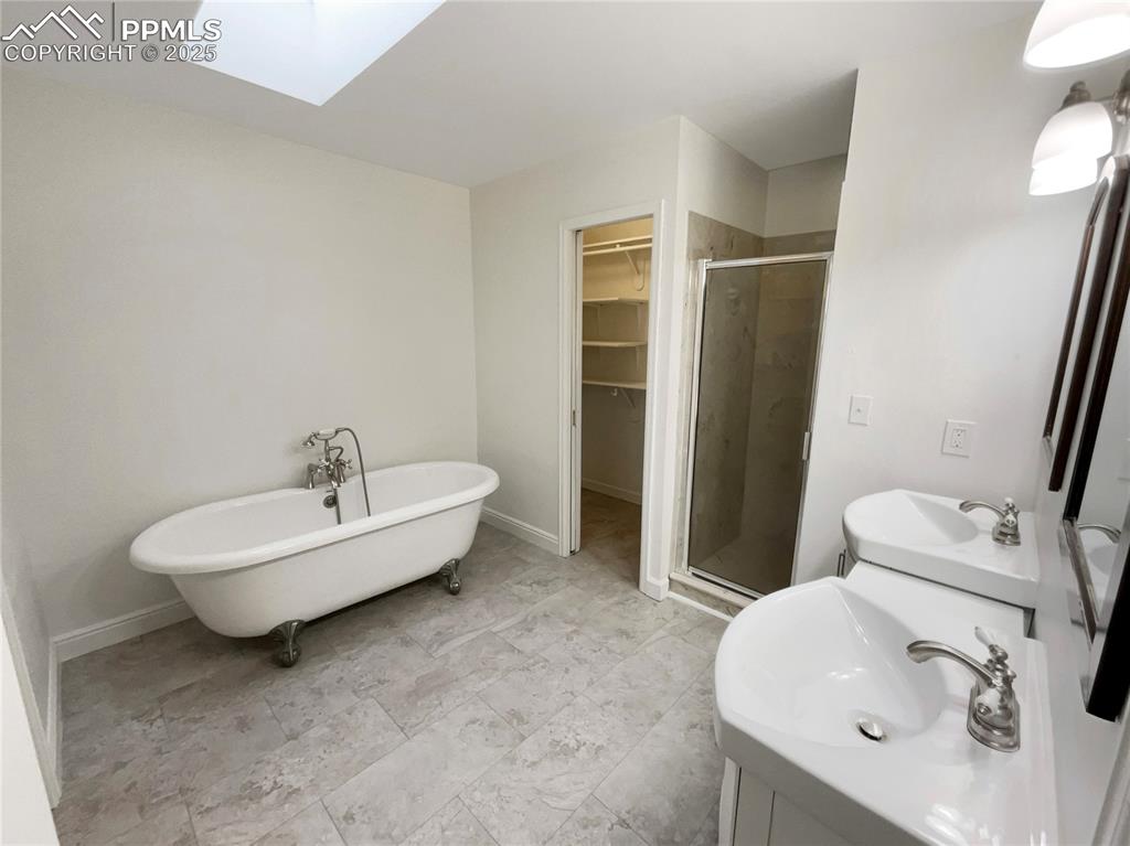 570 Ore Cart Way Monument, CO 80132 - Photo 5 of 22 a bathroom with a sink a toilet and shower